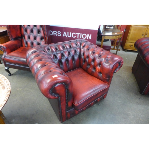 2 - A red leather Chesterfield club chair