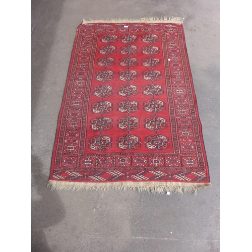 206 - An eastern red ground rug