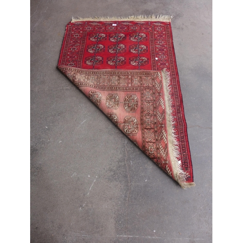 206 - An eastern red ground rug