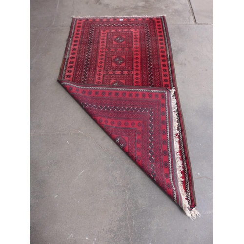 207 - An eastern red ground rug