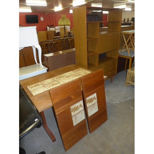 211 - A Danish teak and tiled top extending dining table and a simulated teak room divider