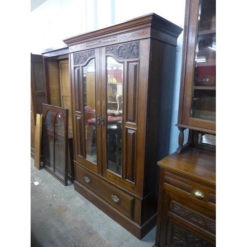 219 - An Edward VII walnut wardrobe