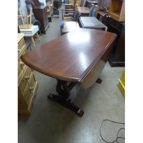 231 - An oak hall table, two open bookcases, an elm drop-leaf table, chairs, etc. (10)