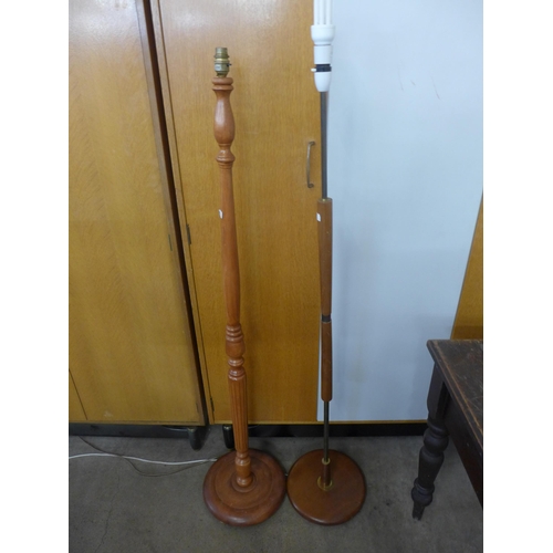 243 - A teak standard lamp and one other