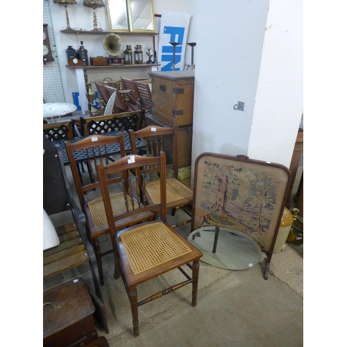 251 - An embroidered firescreen, a bevelled edge oval mirror and a set of three Edward VII mahogany chairs