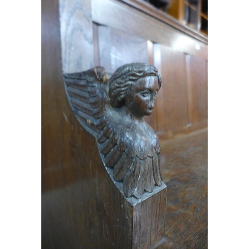 26 - A Victorian carved oak church pew