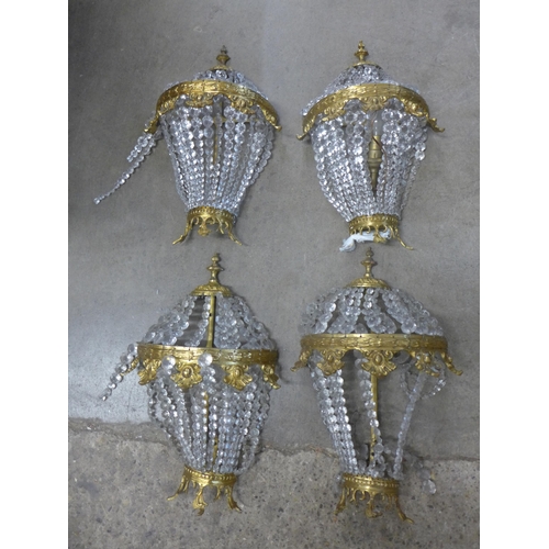 262 - A set of four French Empire style gilt metal and glass bead wall lights