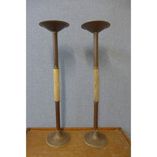 267 - A pair of copper and brass candle stands