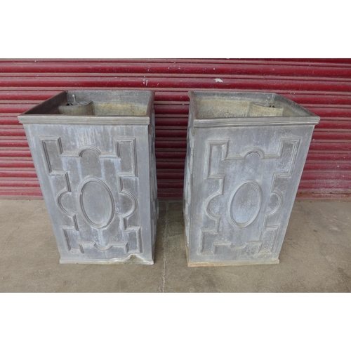 272 - A pair of 17th Century style lead water tanks/planters, 77cms h, 47cms w, 47cms d (the successful bi... 