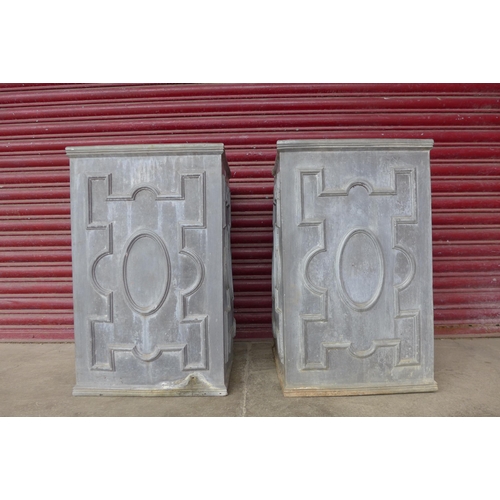 272 - A pair of 17th Century style lead water tanks/planters, 77cms h, 47cms w, 47cms d (the successful bi... 