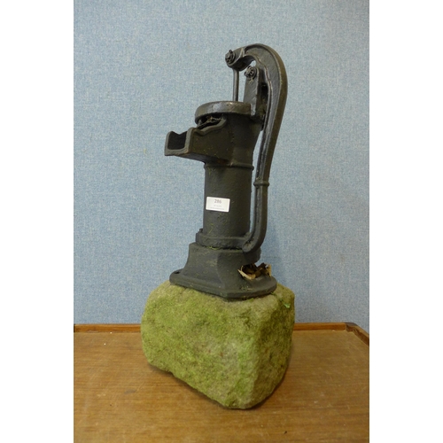 286 - A cast iron water pump, on stone plinth