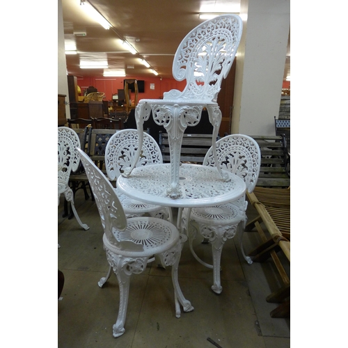 287 - A painted cast alloy garden table and four chairs