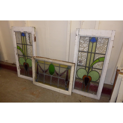 362 - A pair of Art Nouveau stained glass windows and an Art Deco stained glass window