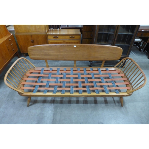 49 - An Ercol elm and beech 355 model studio couch