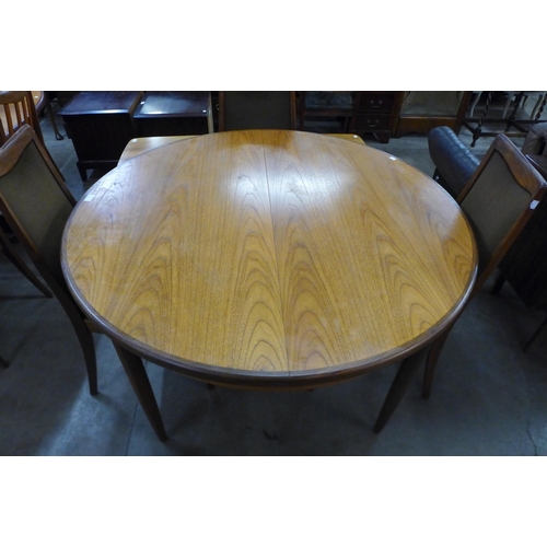 51 - A G-Plan Fresco teak extending dining table and four chairs