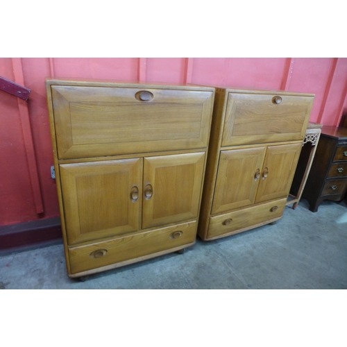 62 - A pair of Ercol Blonde elm 469 model cabinets