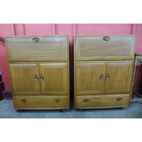 62 - A pair of Ercol Blonde elm 469 model cabinets