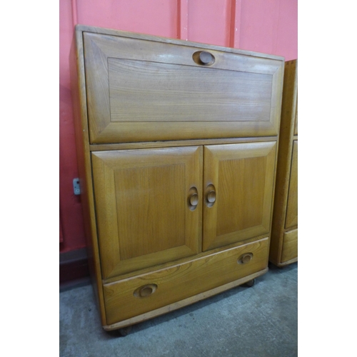 62 - A pair of Ercol Blonde elm 469 model cabinets