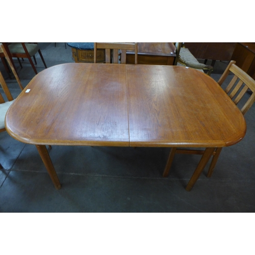 63 - A Danish teak extending dining table and four chairs