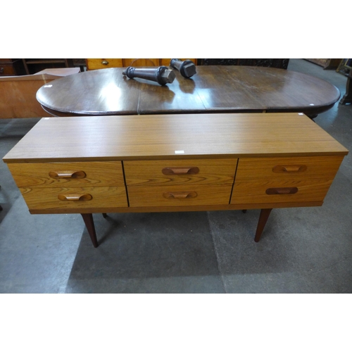 65 - A teak sideboard