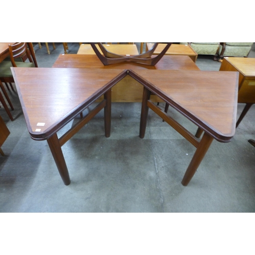 67 - A pair of teak triangular side tables