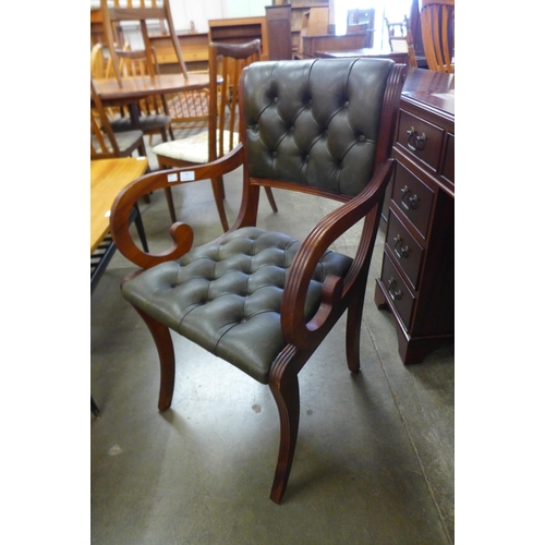 84 - A Regency style mahogany and green leather desk chair