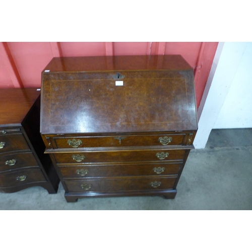 9 - A George I style burr walnut bureau