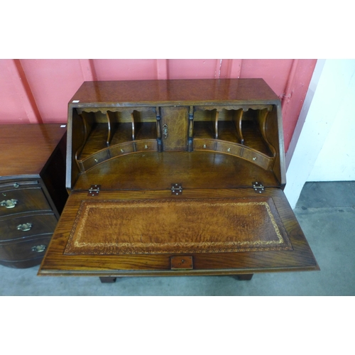 9 - A George I style burr walnut bureau