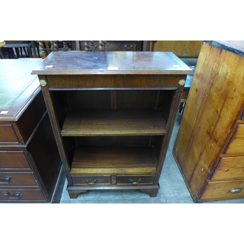 90 - A small mahogany two drawer open bookcase