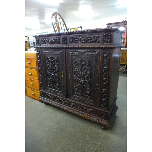 92 - A 19th Century Portuguese carved oak cupboard