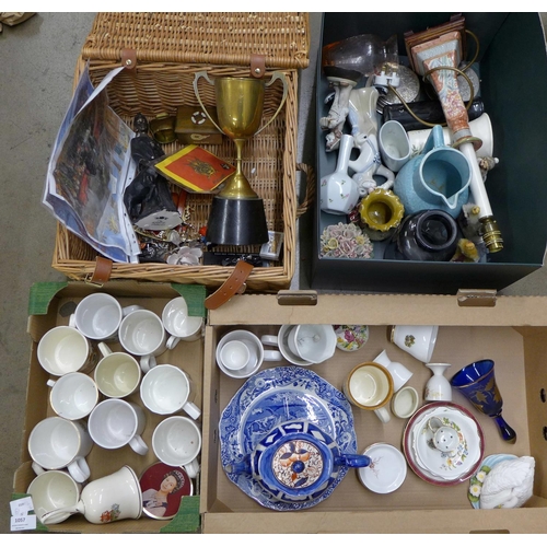 1057 - A box of Royal Family related mugs, a bell, a tin, two boxes of mixed china and a basket of ornament... 