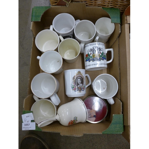 1057 - A box of Royal Family related mugs, a bell, a tin, two boxes of mixed china and a basket of ornament... 