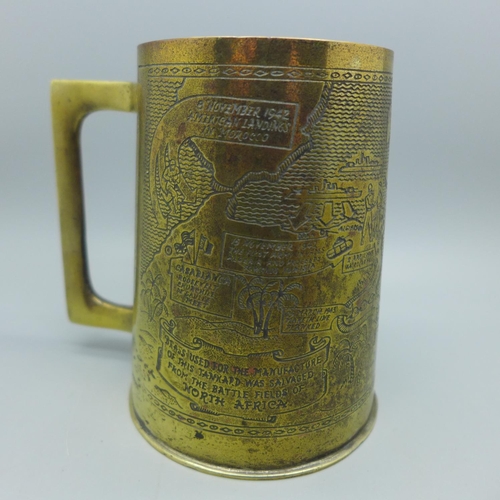 630 - A WWII North Africa campaign brass tankard and a copper trench art money bank in the form of a post ... 