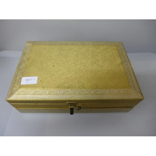 648 - A jewellery box and key, containing vintage and later costume jewellery