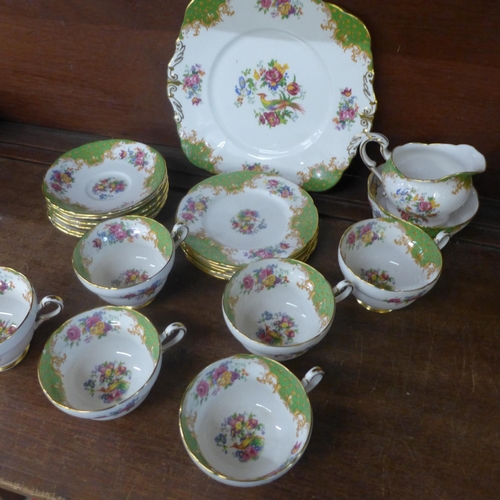 700 - A Paragon Rockingham six setting tea set, one cup with small chip on the rim