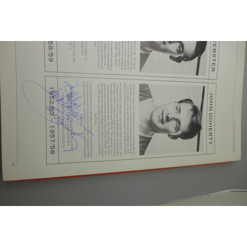 702 - Manchester United; a player by player book containing approximately 97 signatures from former player... 