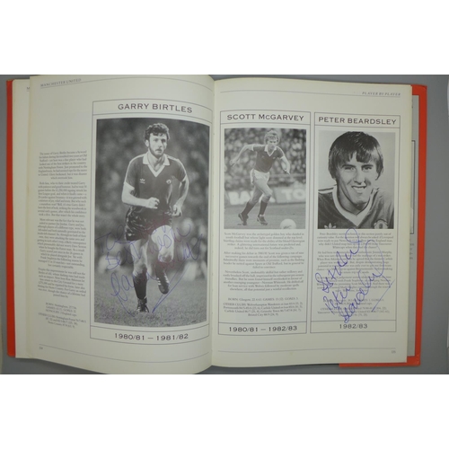 702 - Manchester United; a player by player book containing approximately 97 signatures from former player... 