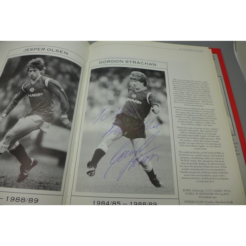 702 - Manchester United; a player by player book containing approximately 97 signatures from former player... 