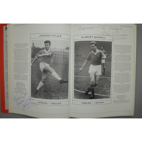 702 - Manchester United; a player by player book containing approximately 97 signatures from former player... 