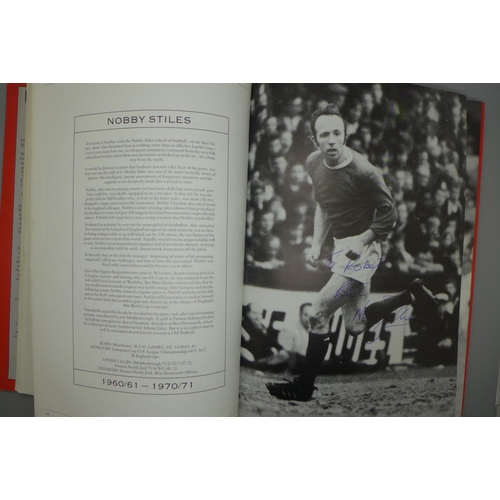 702 - Manchester United; a player by player book containing approximately 97 signatures from former player... 