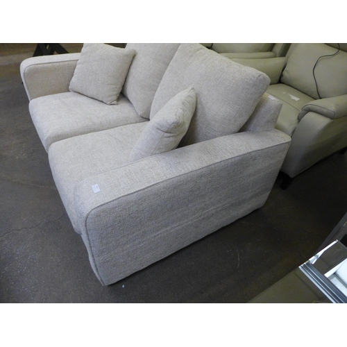 1485 - An oatmeal upholstered two seater sofa