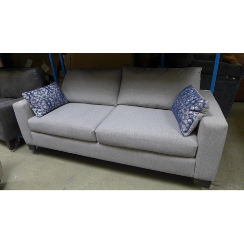 1412 - A grey upholstered three seater sofa