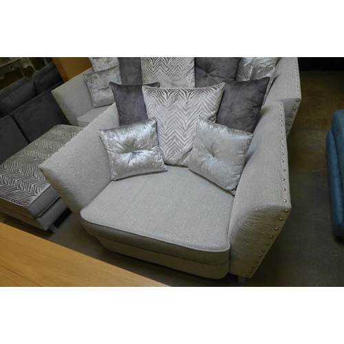 1541 - A Coco Frost upholstered and studded four seater sofa and armchair with footstool (original RRP £180... 