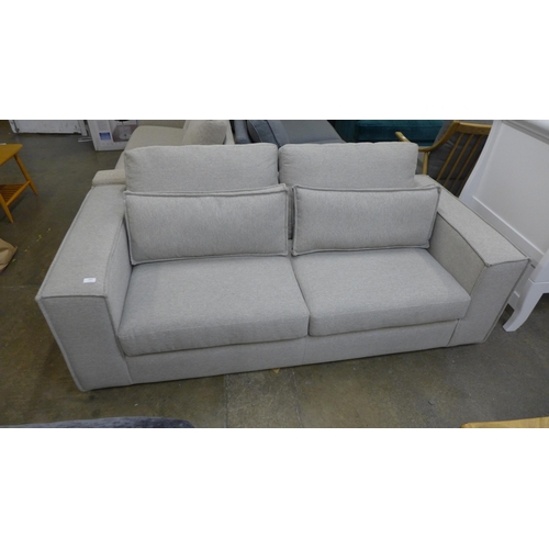 1589 - A grey upholstered three seater sofa