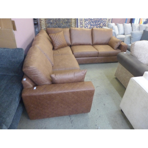 1597 - A dark tan upholstered corner sofa