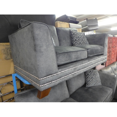 1600 - A  charcoal velvet and studded four seater sofa and three seater sofa (original RRP £3558)