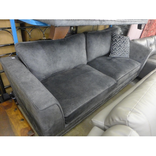 1600 - A  charcoal velvet and studded four seater sofa and three seater sofa (original RRP £3558)