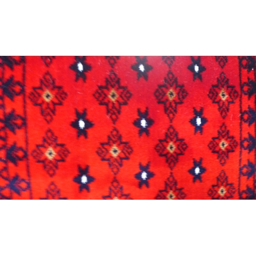 1602 - A rich red ground full pile Turkish runner with an all over design, 300 x 80cm