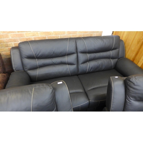 1603 - An Axel black leather and white stitching three seater sofa and a pair of armchairs (original RRP £2... 