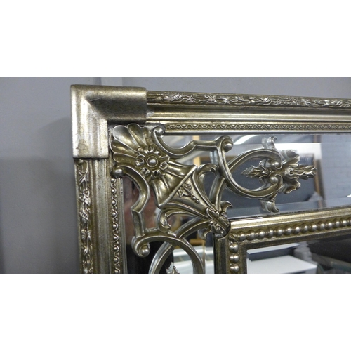 1414 - A 6ft antique style silver mirror - minor damage to frame